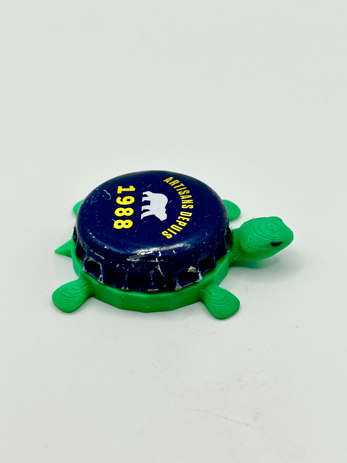 Artisans Depuis 1988 (Navy & Yellow) - Bottle Cap Magnet Turtle