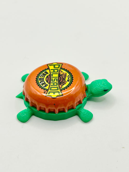 The Palisade Brewery - Bottle Cap Magnet Turtle Shell Shocked Art