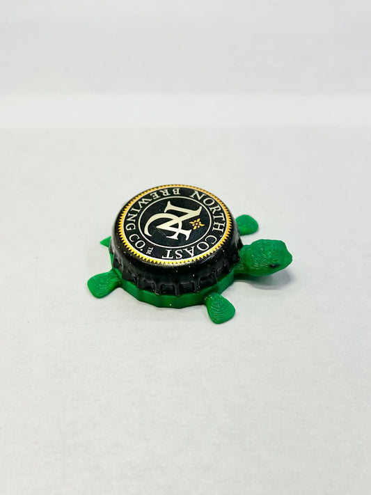 North Coast Brewing Co - Bottle Cap Magnet Turtle Shell Shocked Art