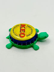 KEO Beer (Cyprus) - Bottle Cap Magnet Turtle Shell Shocked Art