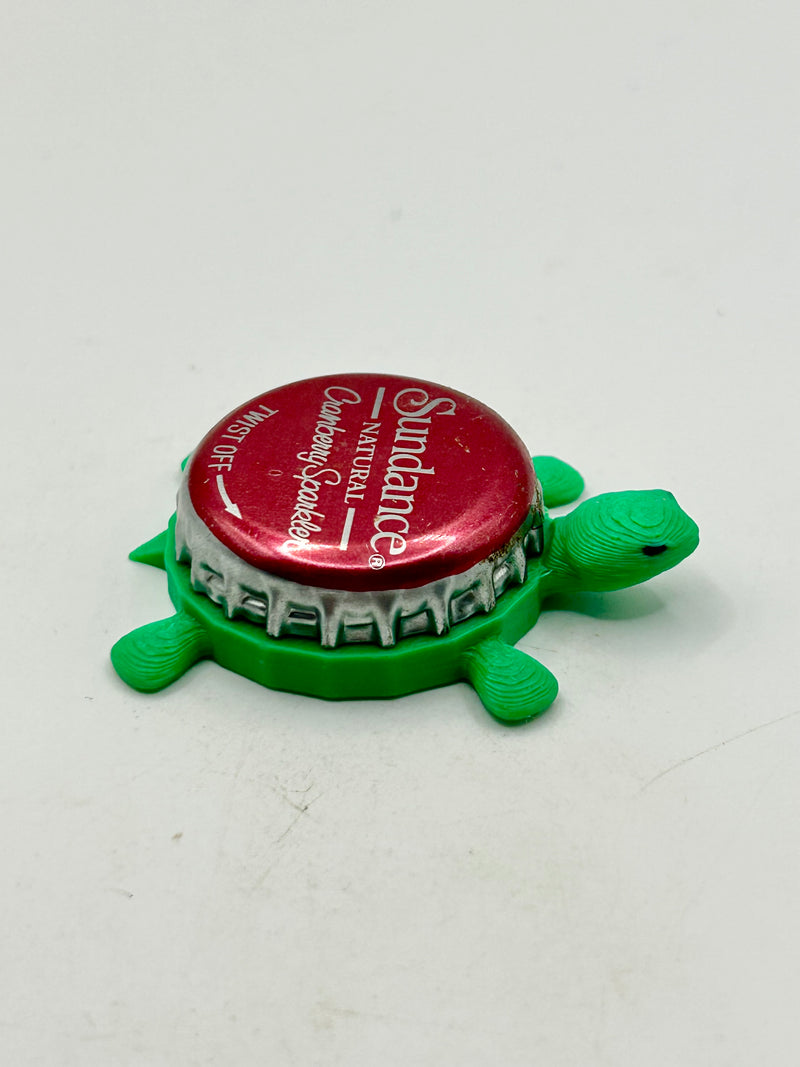 Sundance Cranberry Sparkler - Bottle Cap Magnet Turtle Shell Shocked Art