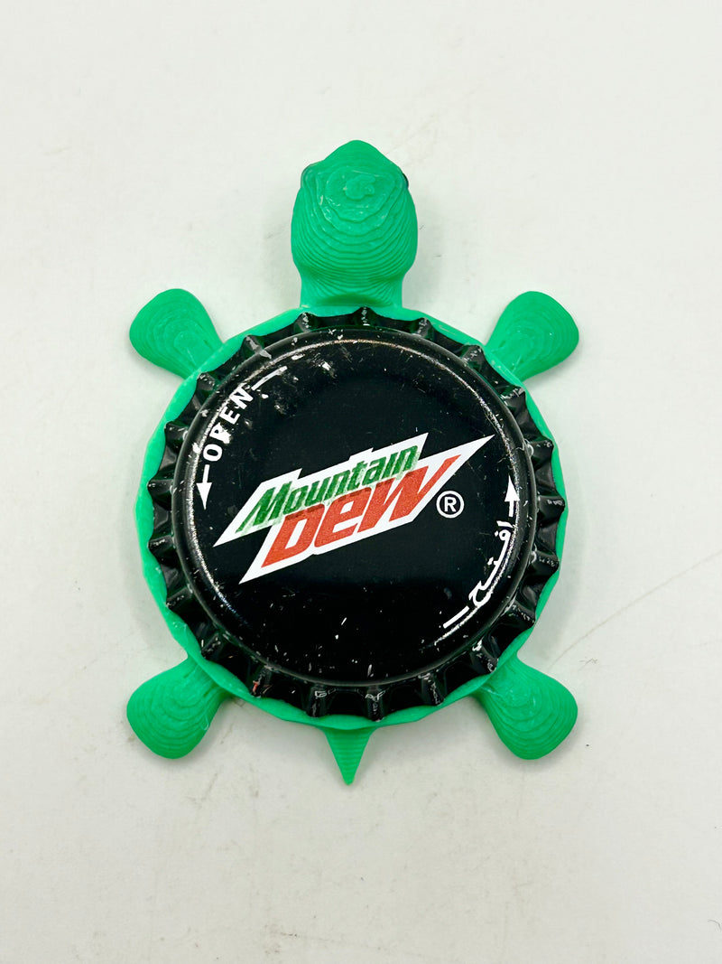 Mountain Dew (International) - Bottle Cap Magnet Turtle Shell Shocked Art