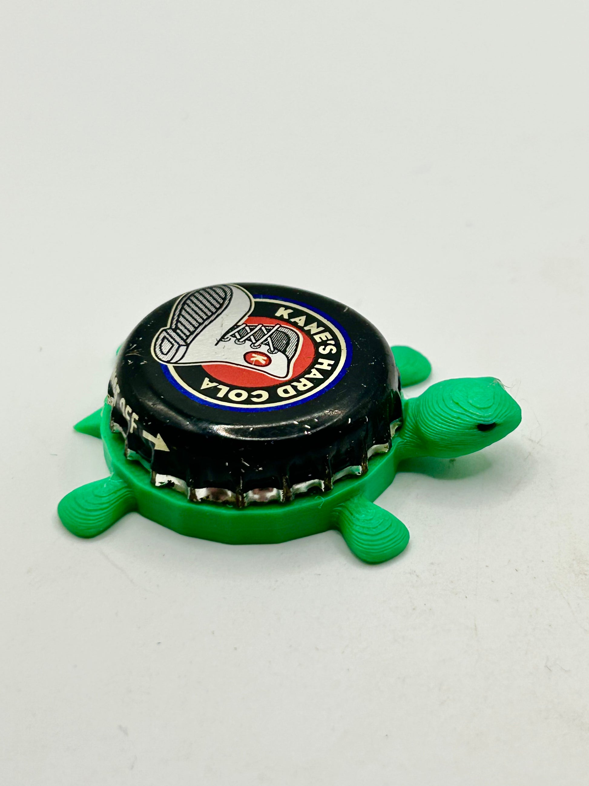 Kane’s Hard Cola - Bottle Cap Magnet Turtle Shell Shocked Art