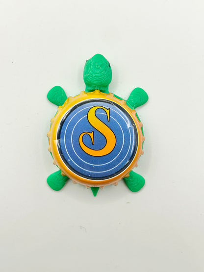 Saugatuck Brewing - Bottle Cap Magnet Turtle Shell Shocked Art