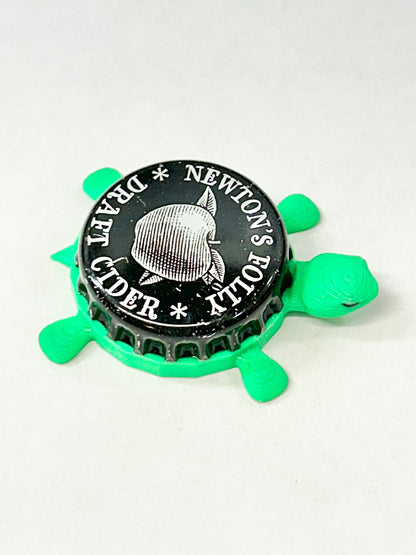 Newton’s Folly Draft Cider - Bottle Cap Magnet Turtle Shell Shocked Art