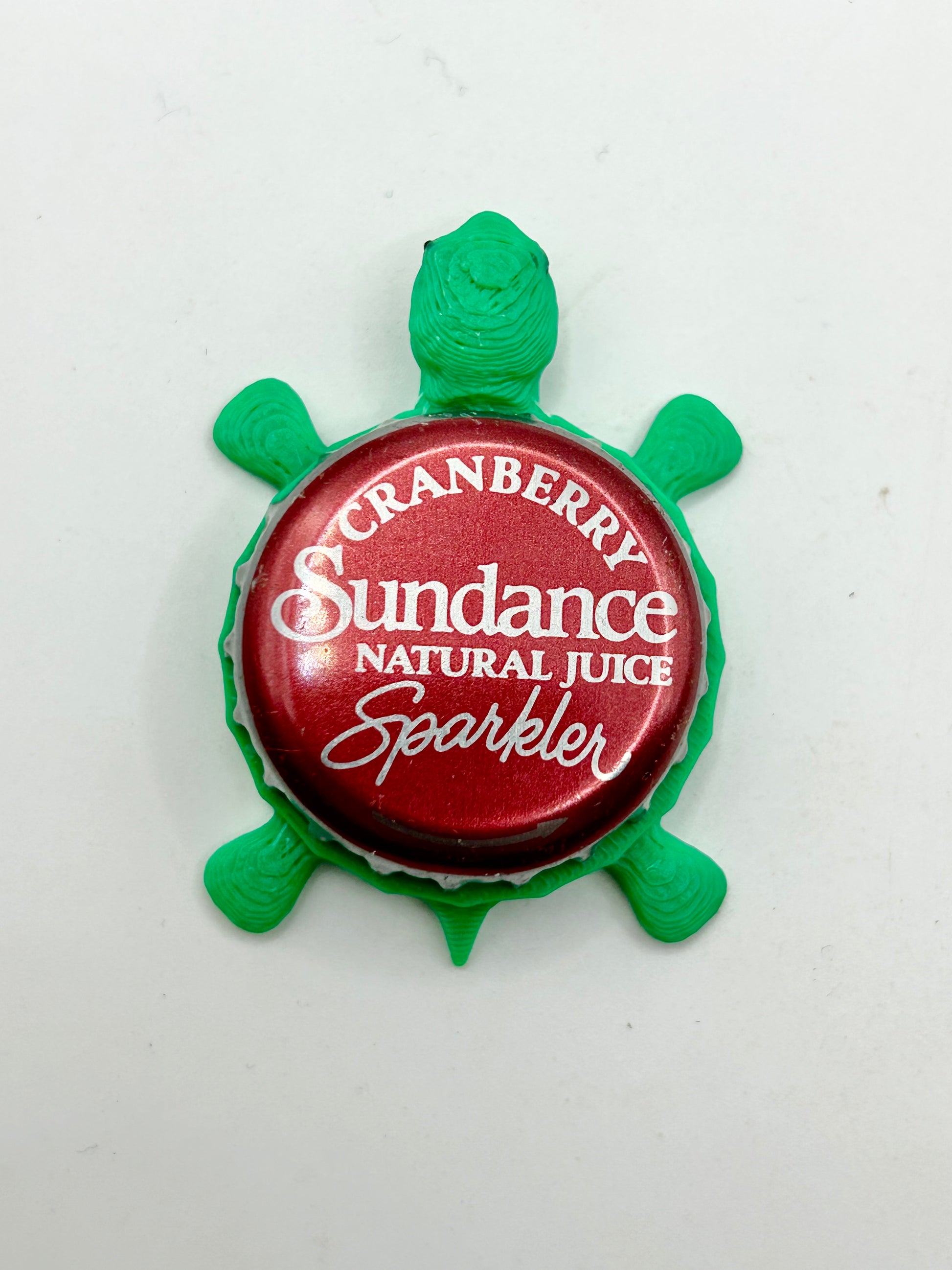 Sundance Cranberry Sparkler - Bottle Cap Magnet Turtle Shell Shocked Art