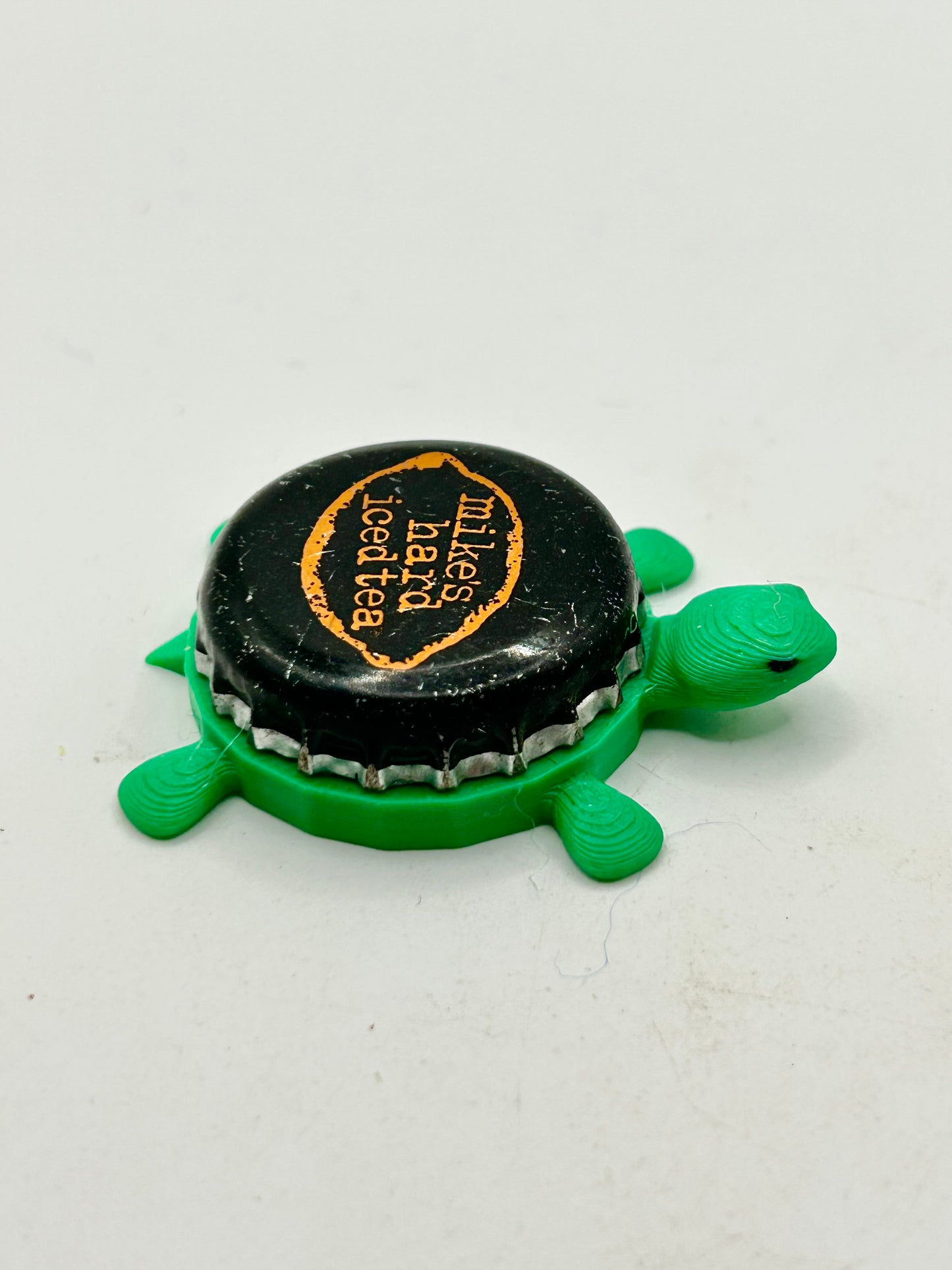 Mikes Hard Iced Tea - Bottle Cap Magnet Turtle Shell Shocked Art