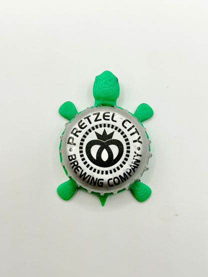 Pretzel City Brewing - Bottle Cap Magnet Turtle Shell Shocked Art
