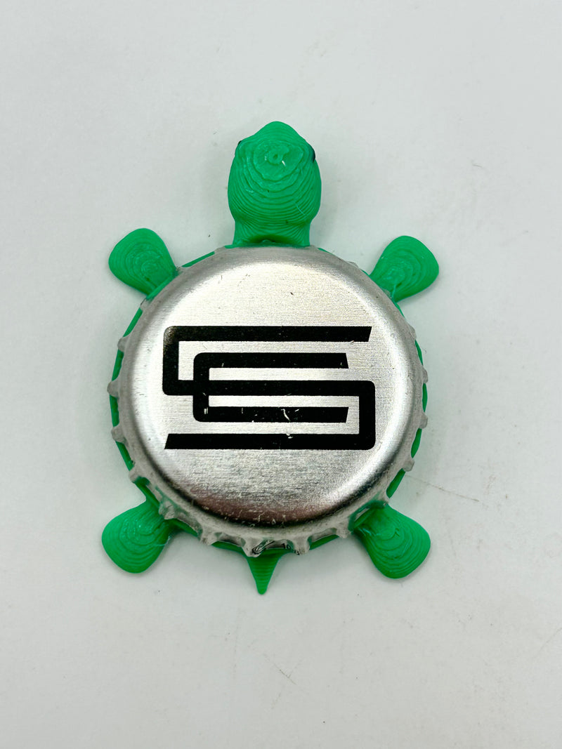 Silver City Brewing - Bottle Cap Magnet Turtle Shell Shocked Art