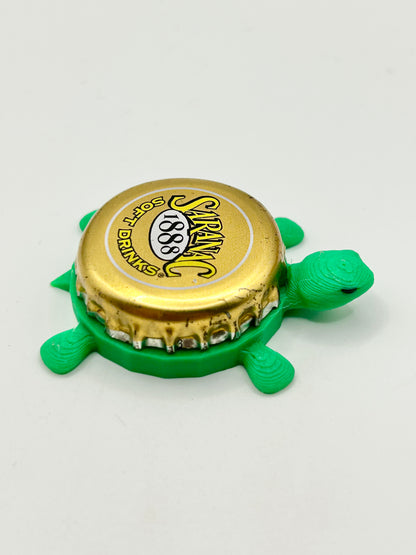 Saranac Soft Drinks - Bottle Cap Magnet Turtle Shell Shocked Art