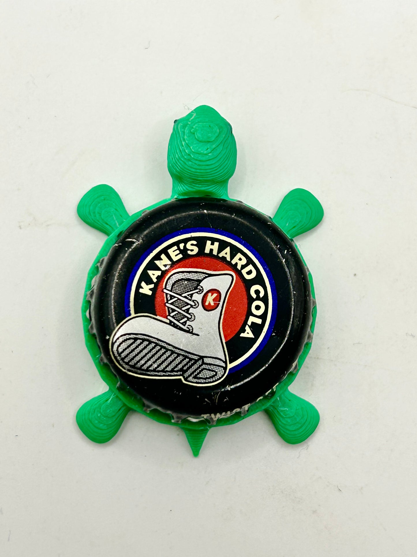 Kane’s Hard Cola - Bottle Cap Magnet Turtle Shell Shocked Art