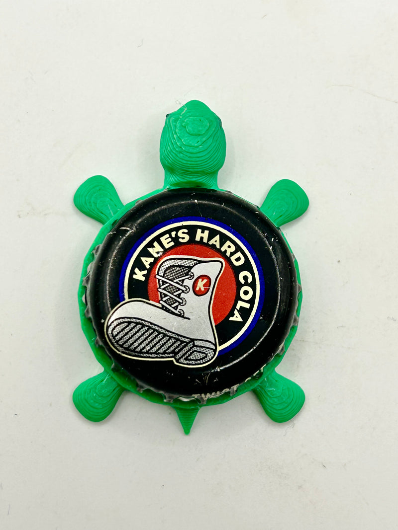 Kane’s Hard Cola - Bottle Cap Magnet Turtle Shell Shocked Art