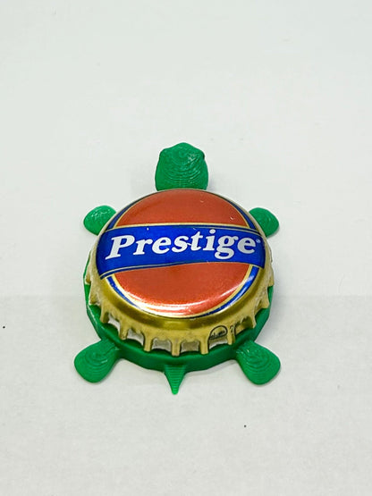 Prestige Beer - Bottle Cap Magnet Turtle Shell Shocked Art
