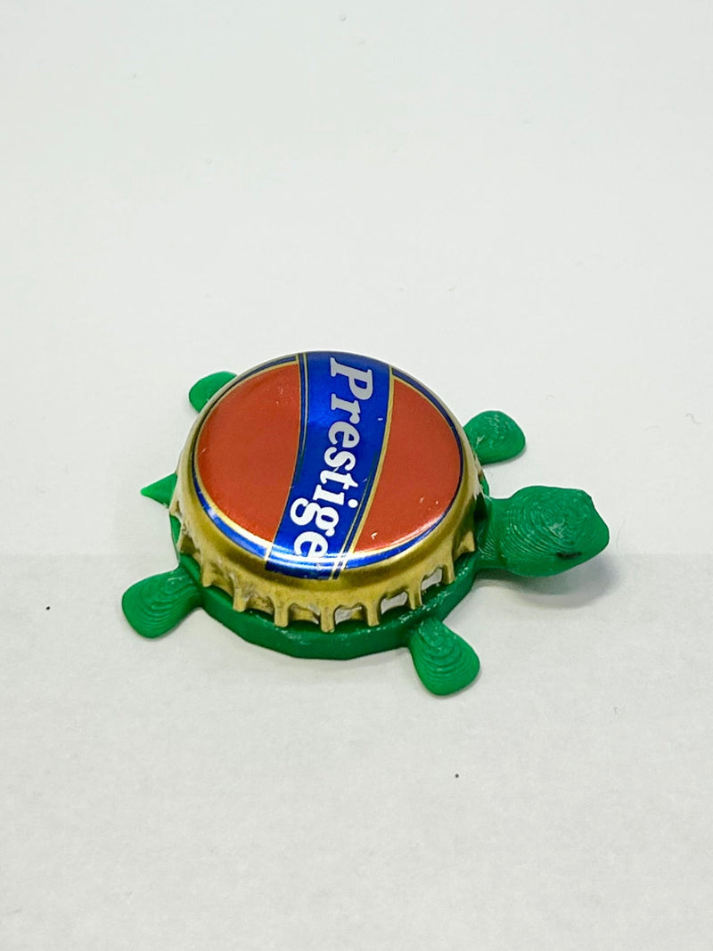 Prestige Beer - Bottle Cap Magnet Turtle Shell Shocked Art